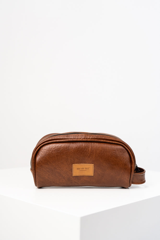 Toiletry bag with brown handle