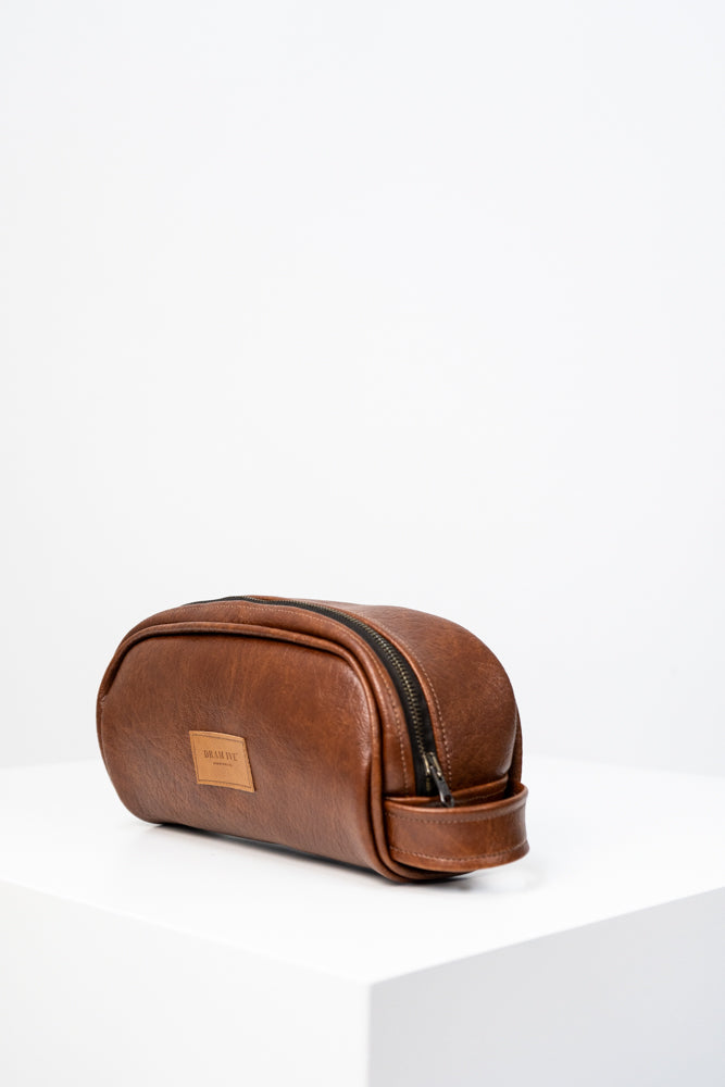 Toiletry bag with brown handle