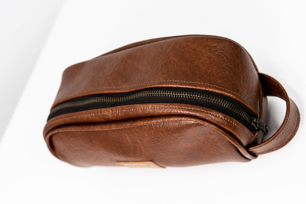 Toiletry bag with brown handle